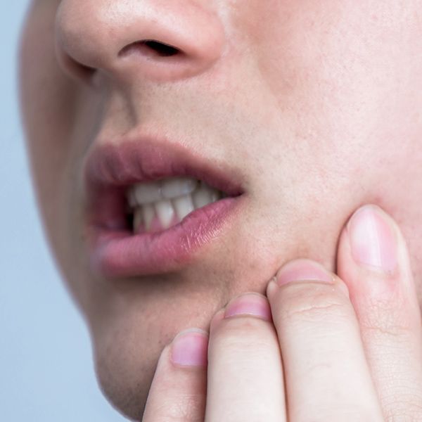 Man holding jaw